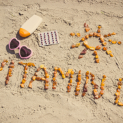 Vitamin D written in sand