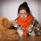 woman, ill, with teddy bear and medicine