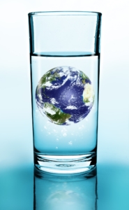 glass of pure water with earth floating in center to symbolize trace minerals from the earth