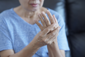 woman suffering from arthritis pain in her hand