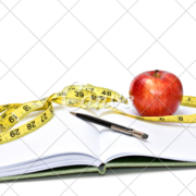 diet diary with apple and tape measure